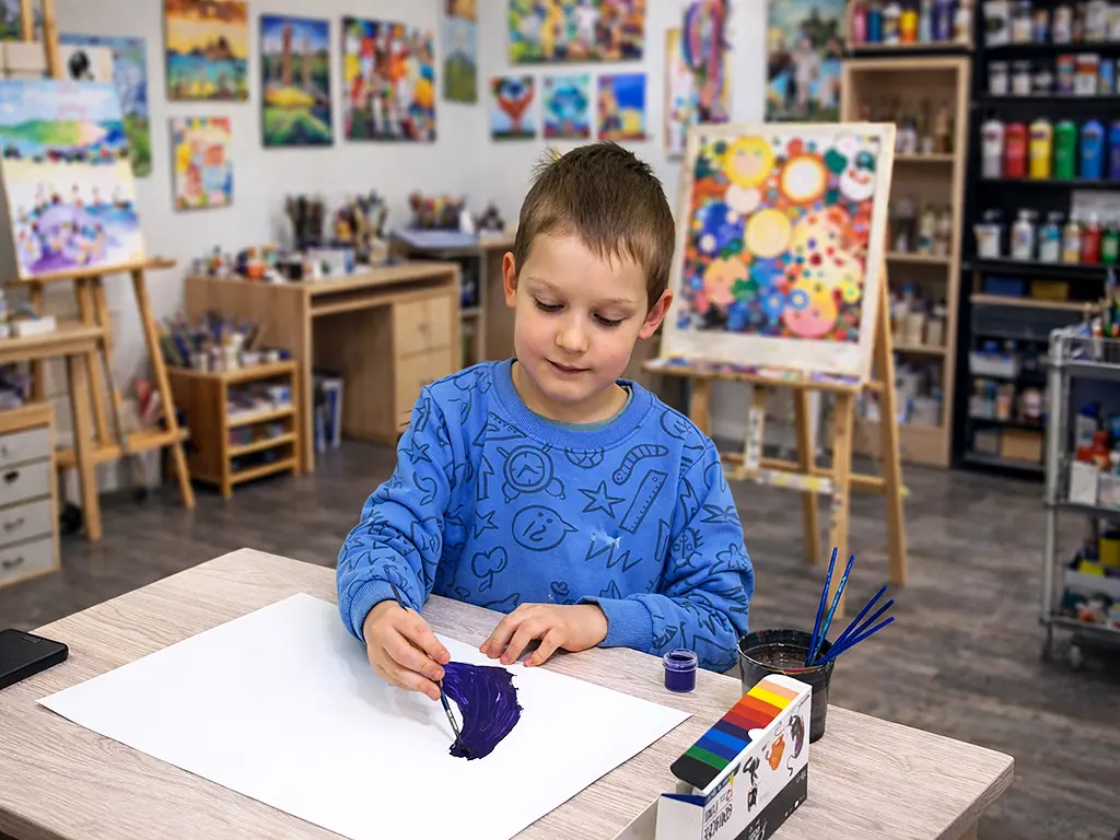 Timosha draws a picture in the studio