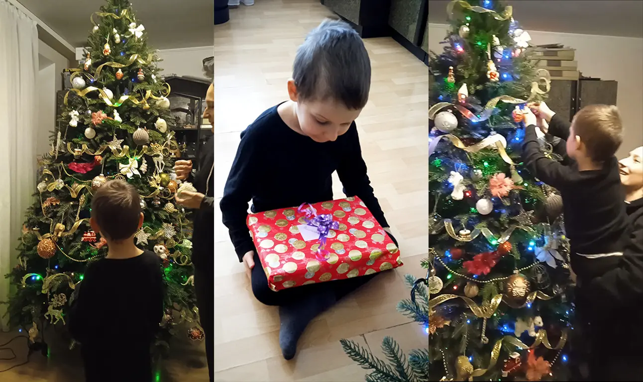 Timosha with a cristmas tree. Timosha with a new year present.