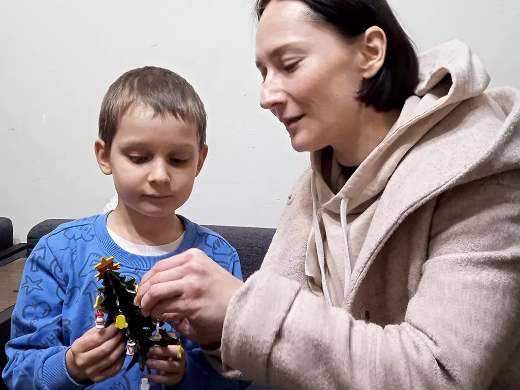 Timosha and Mom are playing with a new toy