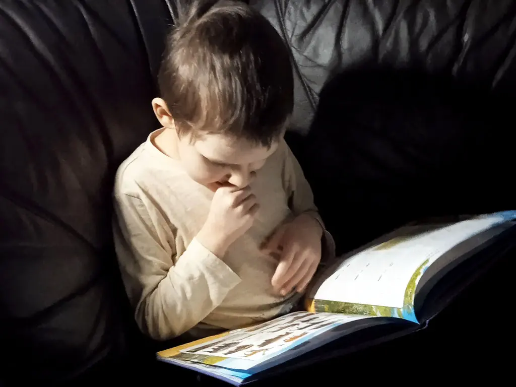 Timosha is reading a book